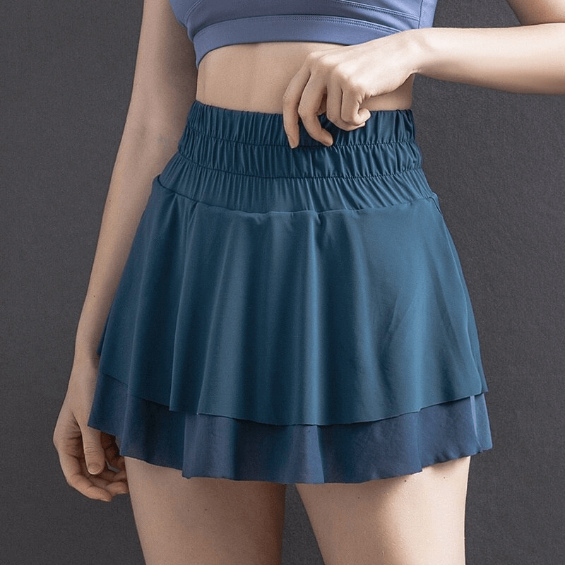 Women's high waist tennis skirt with hidden pockets in blue, perfect for sports like yoga and fitness, offering comfort and mobility.